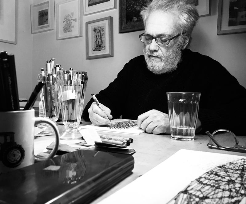 Artist Stephen Talasnik, photographed by his son Liam Talasnik, while drawing at home during the Spring of 2020.
