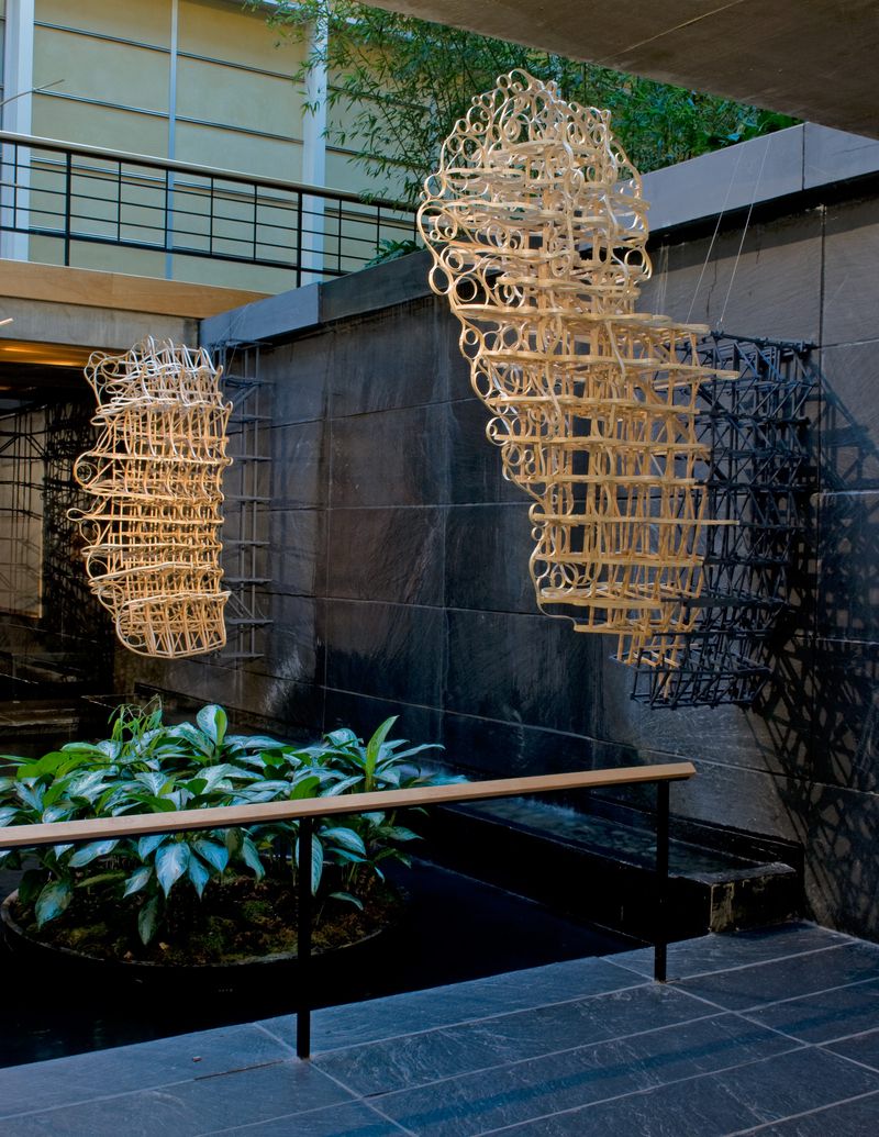 Large wooden hanging sculptures titled New Bamboo by Stephen Talasnik.