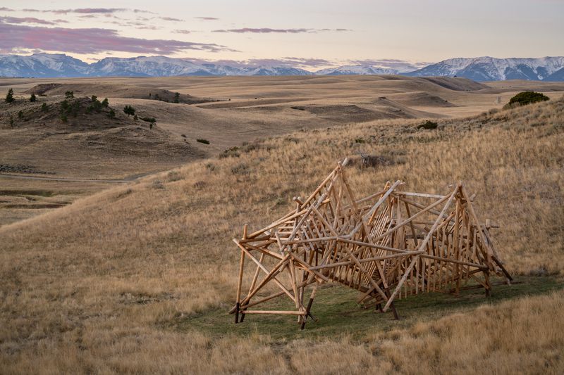 A large wooden installation titled Pioneer by Stephen Talasnik.