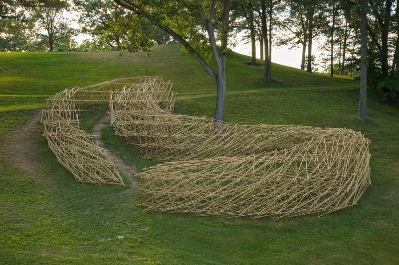 A very large wooden installation titled Stream by Stephen Talasnik.