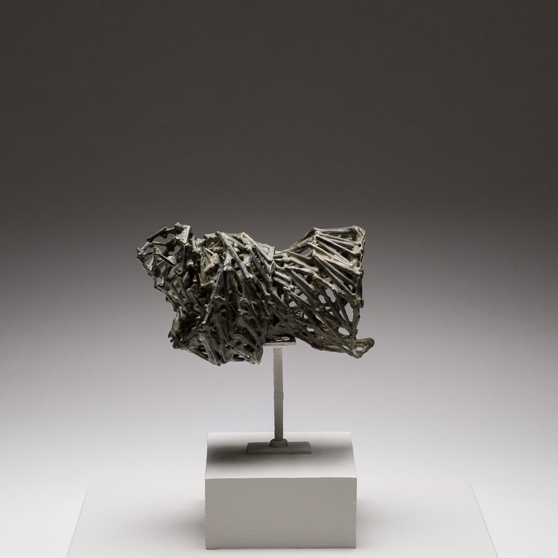 A bronze sculpture titled Repose by Stephen Talasnik.