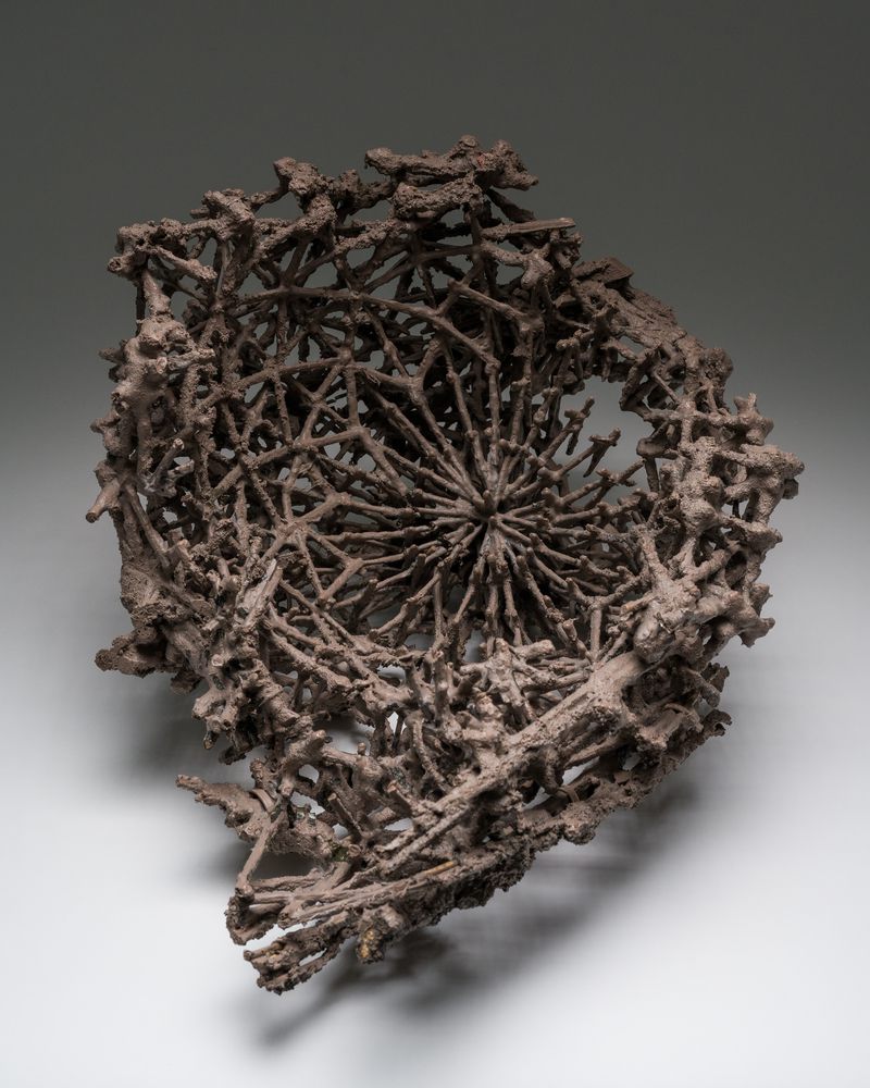 A quarry stone, pigment, acrylic resin, and wood sculpture titled Debris Field #54: Dome by Stephen Talasnik.