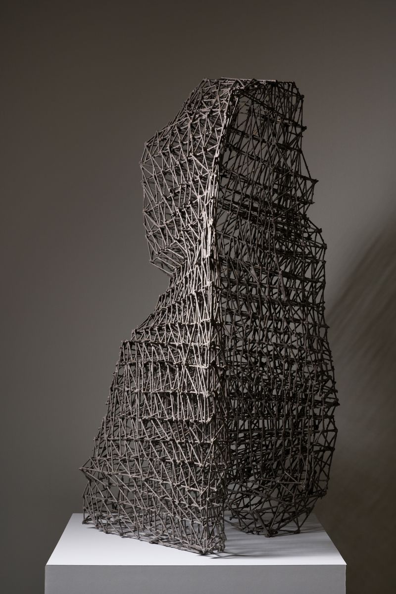 A polymer coated birch dowel sculpture titled Fissure by Stephen Talasnik.